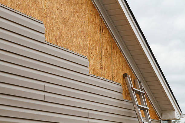 Professional Emergency Siding Repair technician working in Laura, OH